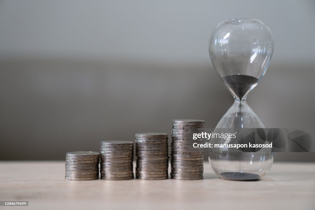 Business concept with coins growth and collecting and saving.
