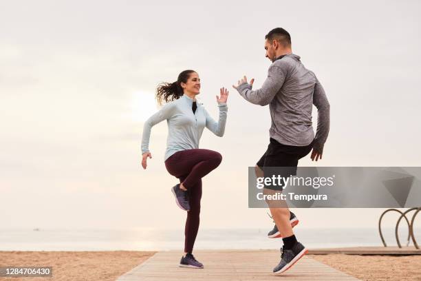 a coach motivating a running athlete. - running coach stock pictures, royalty-free photos & images