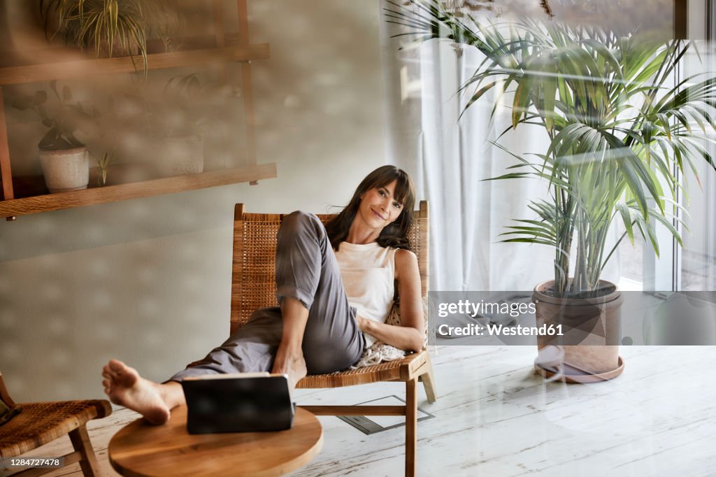 Resting In Chair Woman Resting While Sitting On Chair At Home High-Res Stock Photo ...