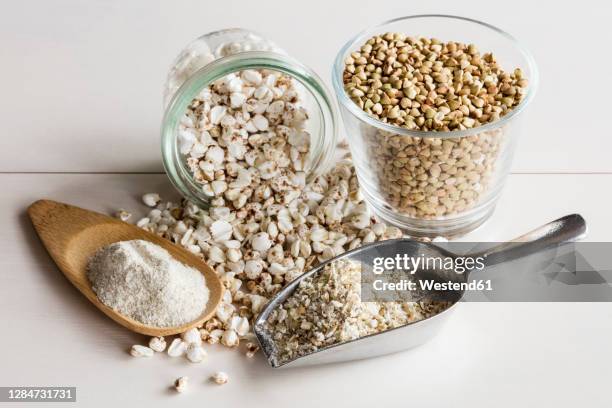 studio shot of buckwheat grains, pops, flakes and flour - buckwheat stock pictures, royalty-free photos & images