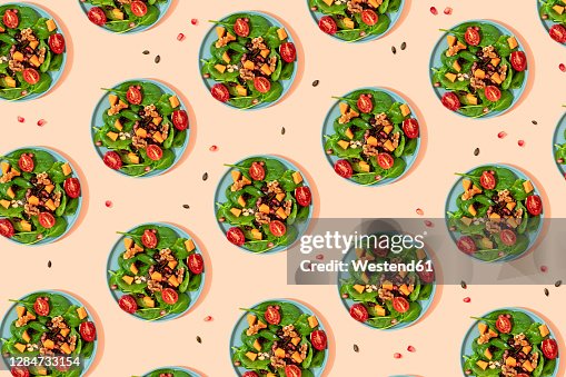 Pattern of plates of fresh ready-to-eat vegan salad Pattern of plates of fresh ready-to-eat vegan salad