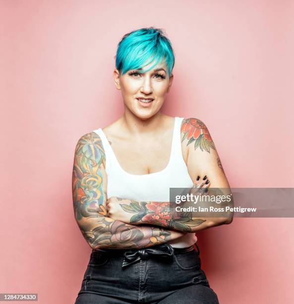 beautiful hipster woman with short blue hair and tattoos - tattoo woman stock pictures, royalty-free photos & images