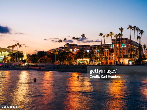 sunset on the beach at cannes in france - cannes france photos et images de collection