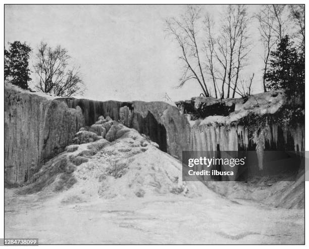 antique black and white photo of the united states: minnehaha falls in winter - mississippi river fall stock illustrations