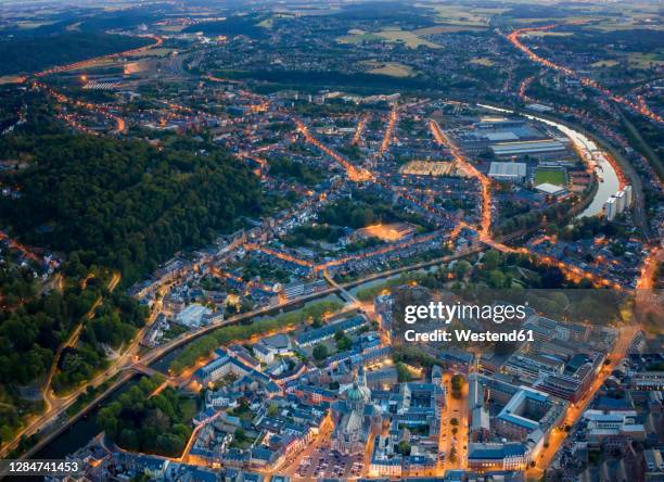 belgium, namur province, namur, aerial view of riverside city at dusk - belgium aerial stock pictures, royalty-free photos & images