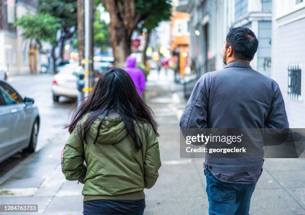 walking on the street together - castro district stock pictures, royalty-free photos & images