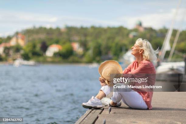 a beautiful day by the sea - boat old stock pictures, royalty-free photos & images