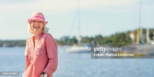 woman enjoying a vacation by the sea - boat scandinavia stock pictures, royalty-free photos & images