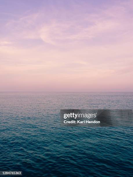 textures and ripples mix with a colourful sky in menton france - stock photo - seascape horizon bildbanksfoton och bilder