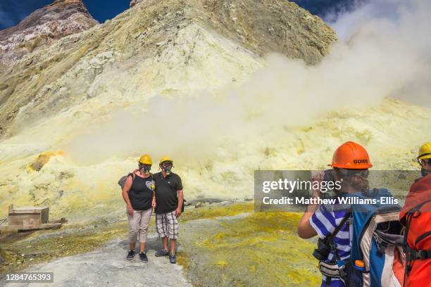 Tourists on a sightseeing tour of White Island Volcano, an active volcano in the Bay of Plenty, North Island, New Zealand.