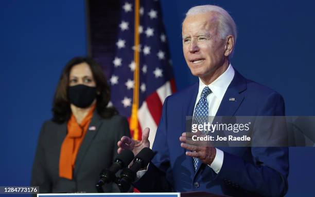 President-elect Joe Biden speaks to the media while flanked by Vice President-elect Kamala Harris, at the Queen Theater after receiving a briefing...