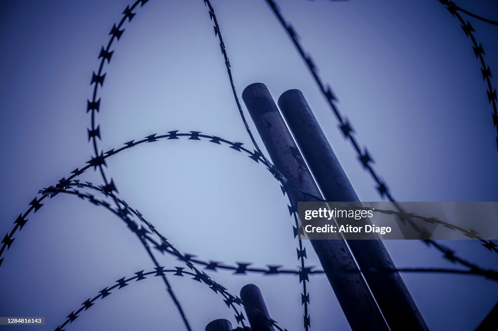 Close-up of very sharp barbed wire of a security fence.