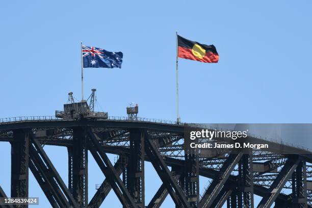 The Australian Aboriginal flag flies atop the Sydney Harbour Bridge alongside the Australian National flag in respect of NAIDOC week on November 10,...