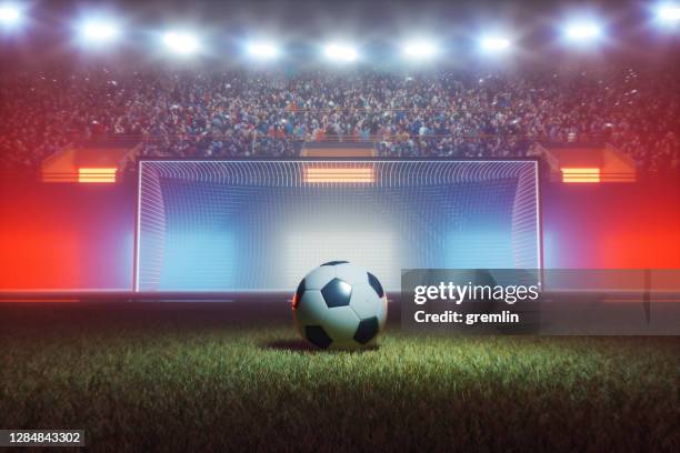football stadium at night - penalty kick stock pictures, royalty-free photos & images