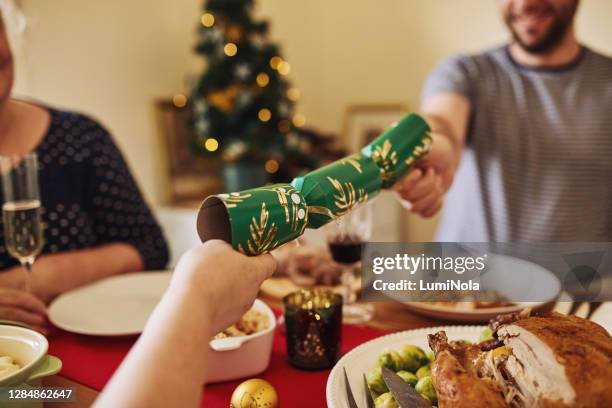 call it a little bonus gift - christmas crackers stock pictures, royalty-free photos & images