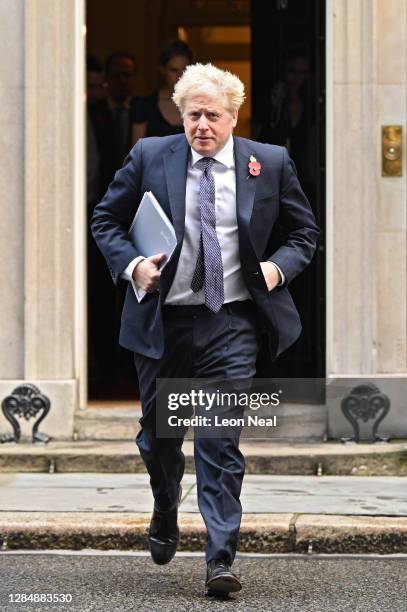 Britain's Prime Minister Boris Johnson leaves number 10, Downing Street as he heads to the weekly Cabinet meeting at the Foreign Office on November...