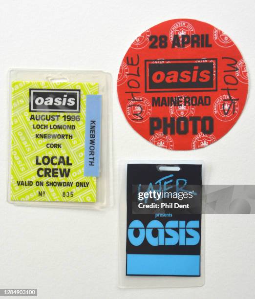 Music memorabilia - Photo passes and laminates for shows by Oasis at Maine Road , Knebworth and the TV show "Later…presents Oasis" , photographed on...