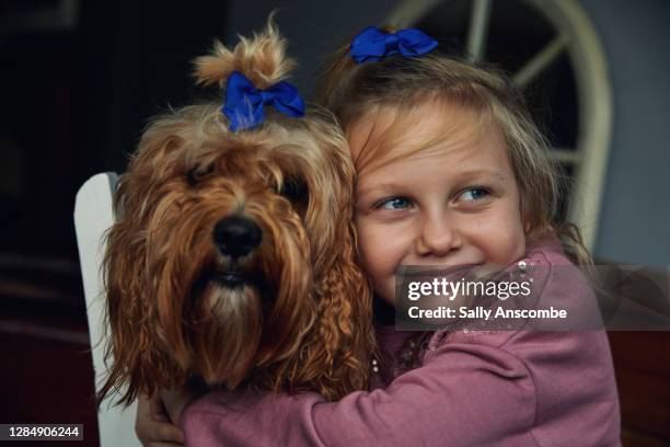 little girl with her pet dog - dubbelgångare bildbanksfoton och bilder