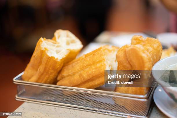 youtiao, fried dough sticks - youtiao stock pictures, royalty-free photos & images