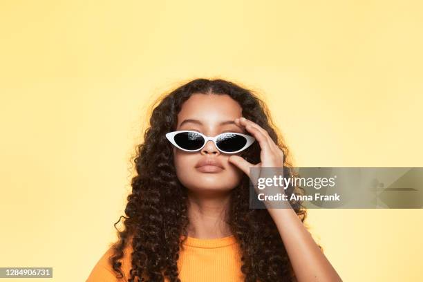 a portrait of cool teenager with white sunglasses - sunglasses imagens e fotografias de stock