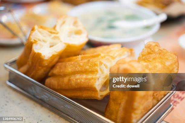 youtiao, fried dough sticks - youtiao stock pictures, royalty-free photos & images