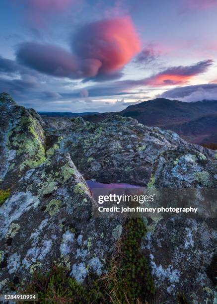 lingmore fell sunset with lenticular clouds. lake district national park. uk. - lingmoor fell stock pictures, royalty-free photos & images