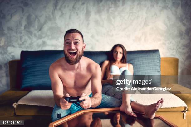 male defeating girlfriend in video game - families nude stock pictures, royalty-free photos & images