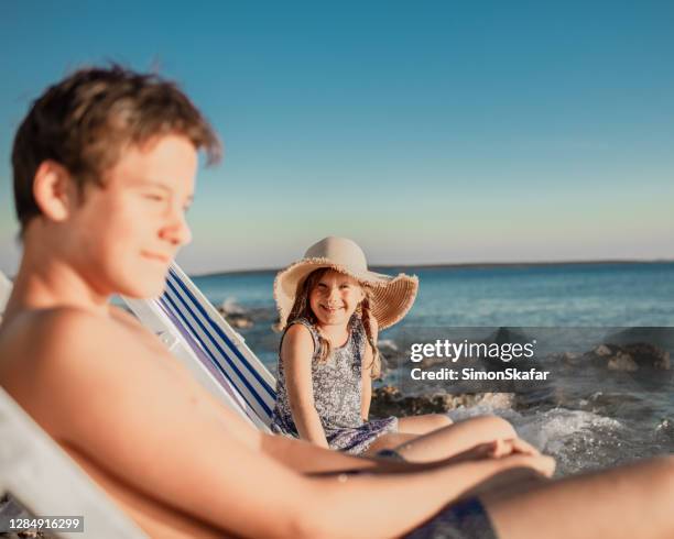 Boy And Girl On Beach In Summer High-Res Stock Photo