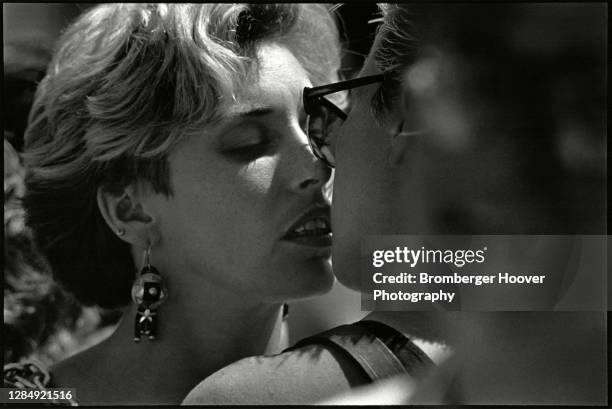 Close-up of two women about to kiss one another, outside the Civic Center during the International Lesbian & Gay Freedom Day Parade, San Francisco,...