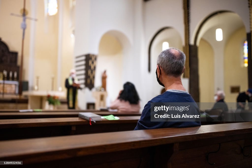 Senior man attending congregation at church