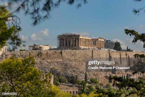 view of acropolis and parthenon from filopappou hil, athens, greece - athens greece ストックフォトと画像