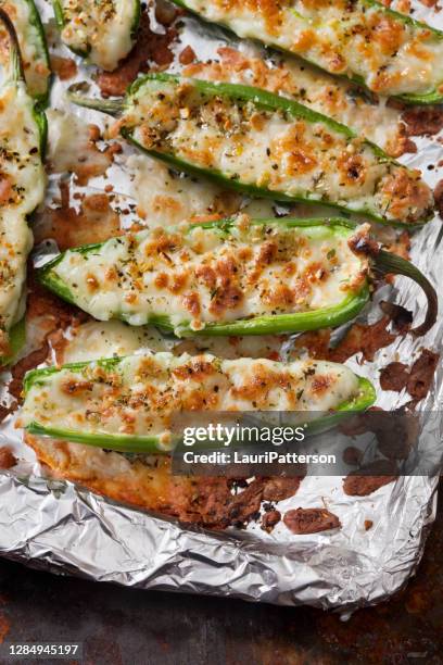 baked jalapeno poppers - jalapeno pepper stock pictures, royalty-free photos & images