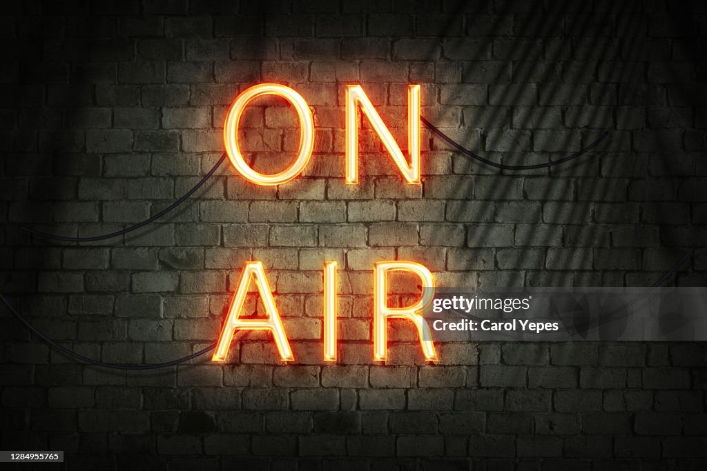 On Air Red Neon Light On Black Wall
