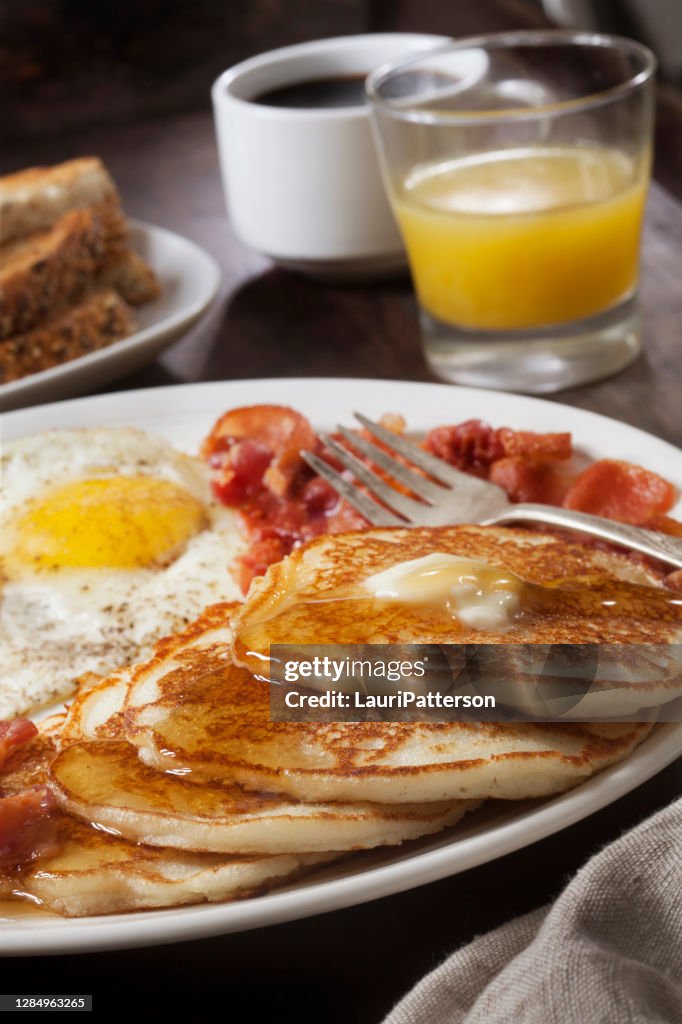 Grand Slam Breakfast with Pancakes, Bacon, Eggs, and Toast