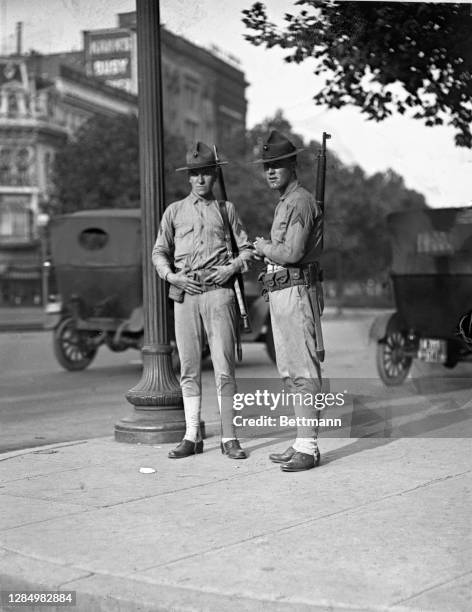 Armed Marines from Quantico barracks on guard duty on Pennsylvania Avenue, Washington, D.C. Despite the fact that the city has resumed its normal...