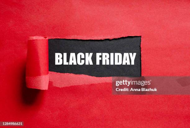 black friday text. torn red paper with copy space for text. - black friday shopping stockfoto's en -beelden