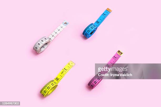 Set Of Colored Tapes Measure On Pastel Pink Background High-Res Stock Photo  - Getty Images