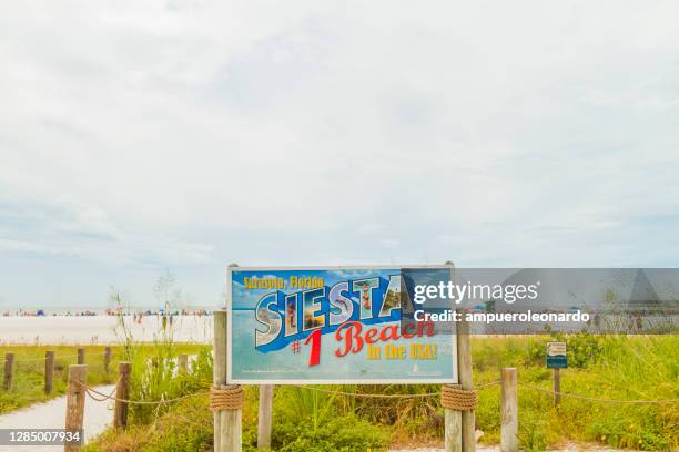 siesta beach, sarasota, florida, united states of america usa, florida number 1 beach in usa sign - siesta key beach stock pictures, royalty-free photos & images