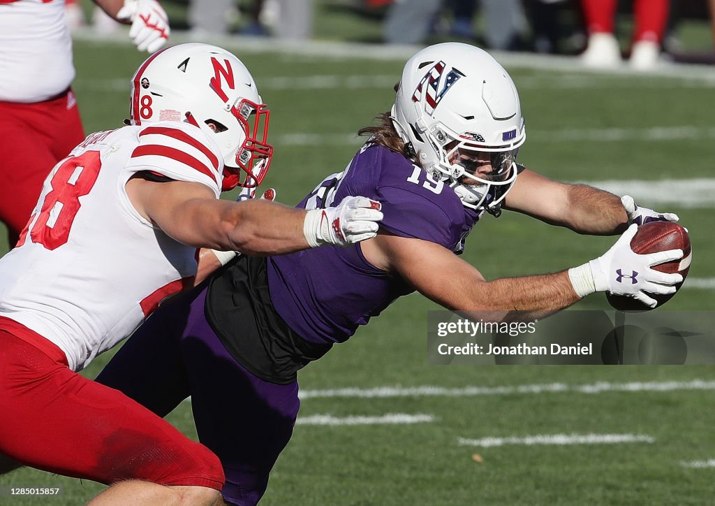 Alex Riley Nebraska Riley Lees of the Northwestern Wildcats dives past Luke Reimer of the ...
