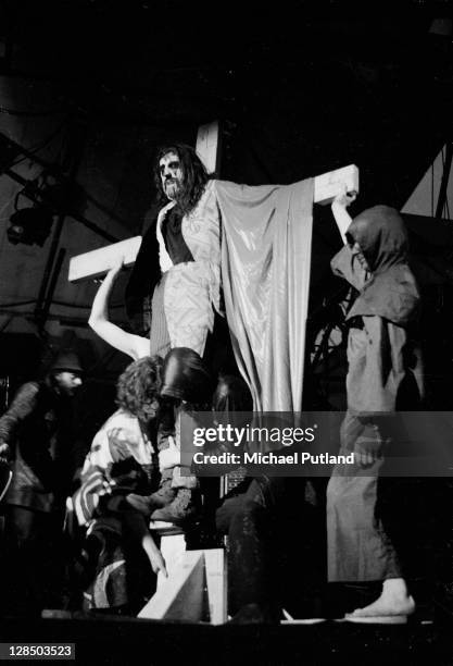 Arthur Brown is strapped to a crucifix while performing at the Reading Festival, 25th June 1971.