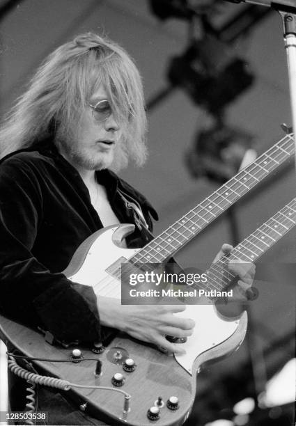 Clem Clempson of Colosseum performs on stage at Reading Festival, 27th June 1971. He plays a twin-necked guitar.