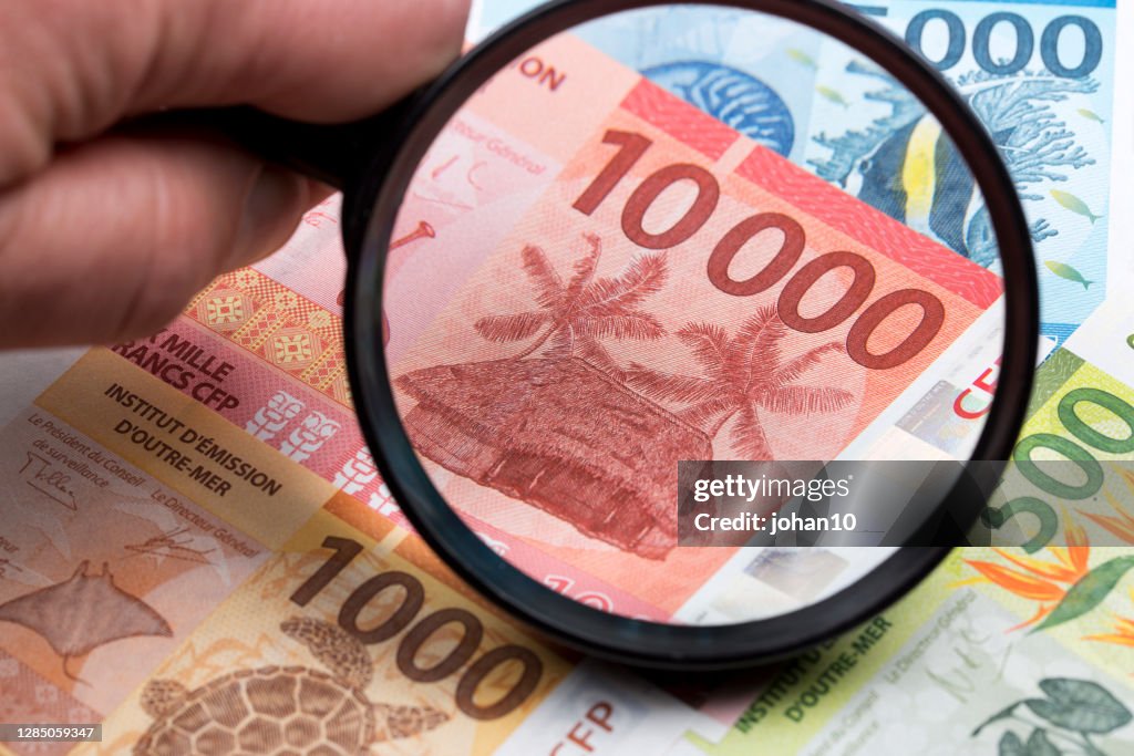 French Pacific Territories Francs in a magnifying glass
