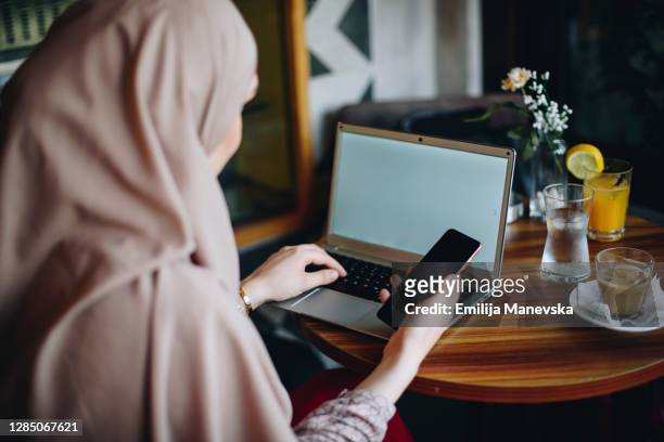 Muslim businesswoman working from home