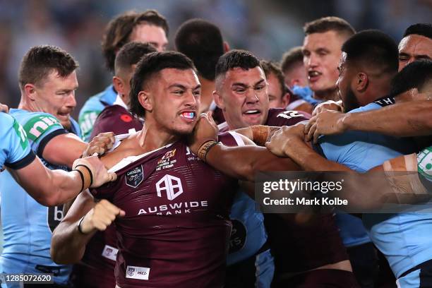 Tino Fa'asuamaleaui of the Maroons and Payne Haas of the Blues scuffle during game two of the 2020 State of Origin series between the New South Wales...