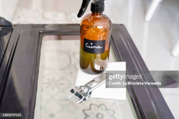 cleaning the oven door - dirty oven stock pictures, royalty-free photos & images