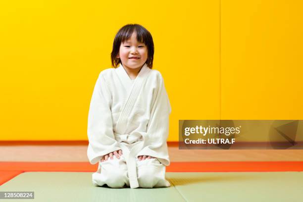 judo player of a young girl - martial arts kid stock pictures, royalty-free photos & images