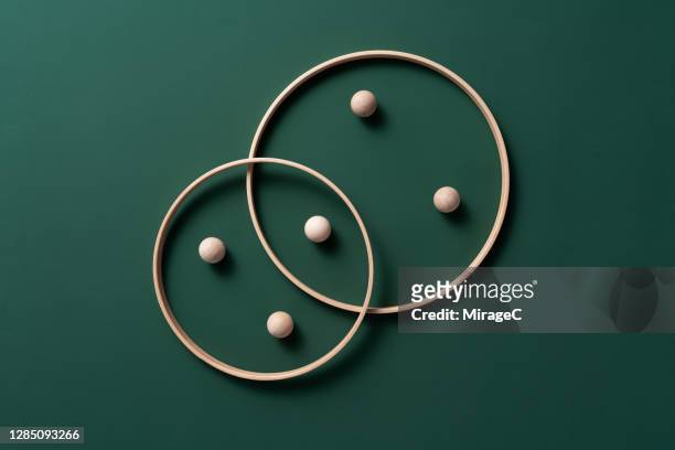 crossing rings with spheres - group c foto e immagini stock