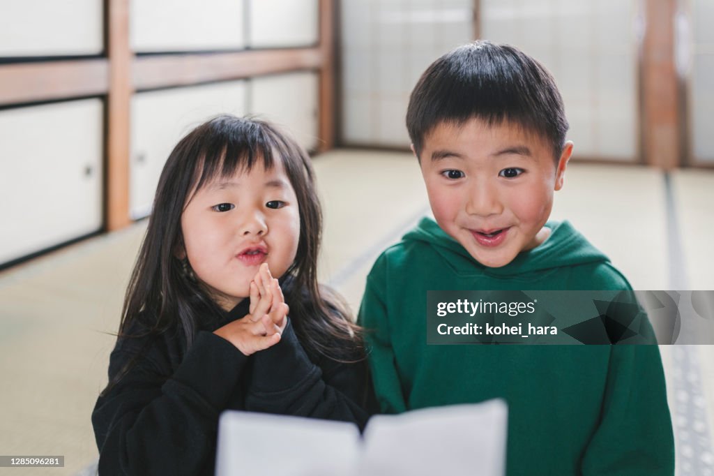 Japanese children getting Otoshidama, money given as a gift at the New Year