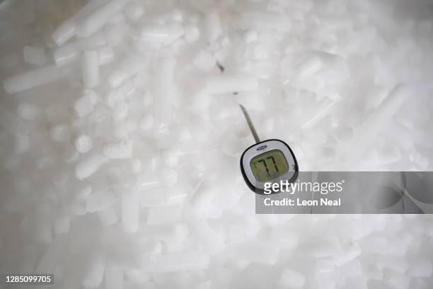 Thermometer displays a temperature of -77 degrees centigrade as it rests in a supply of coarse dry ice pellets at the Dry Ice Nationwide...