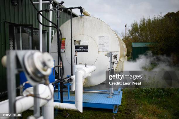 Container of liquid carbon dioxide vents gas during a part of the production process at the Dry Ice Nationwide manufacturing facility on November 11,...